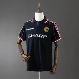 retro-premier-manchester-united-manchester-united-alternativa-1998-99_0.webp Manchester United Alternativa 1998-99 - Versión Retro