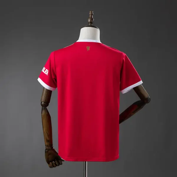 retro-premier-manchester-united-manchester-united-local-2021-22_1.webp Manchester United Local 2021-22 - Versión Retro